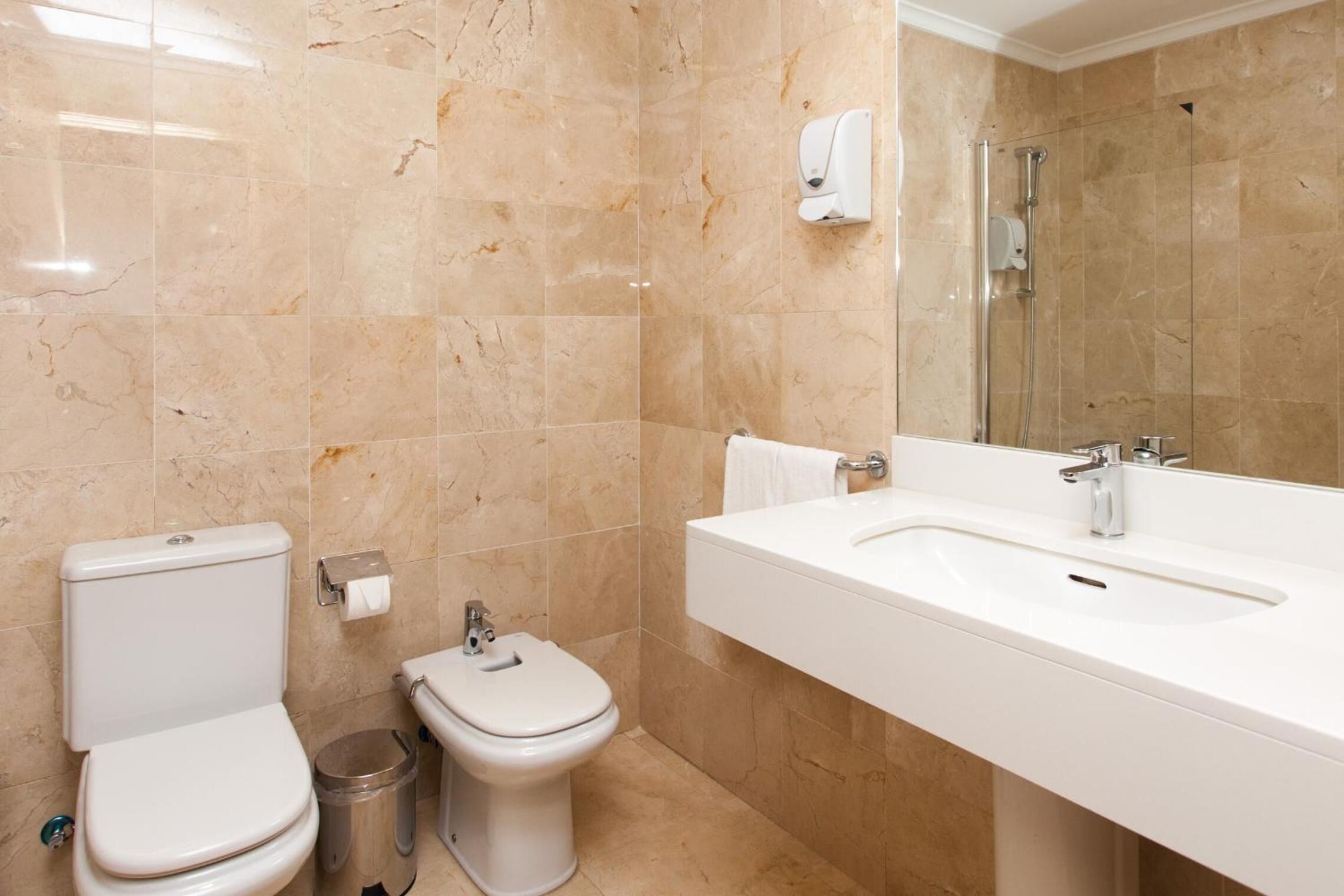 free toiletries, hair dryer, bidet, towels