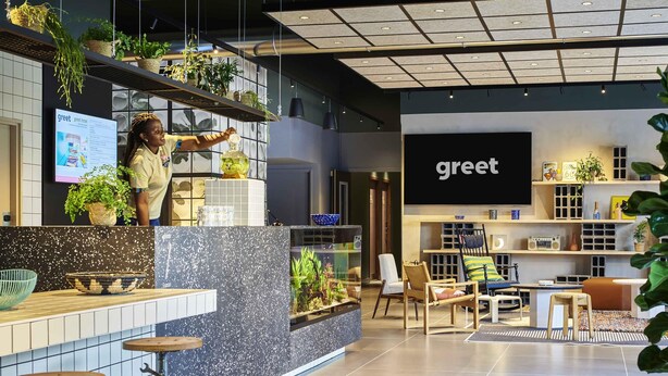 A modern hotel lobby with a reception desk, bar stools, and a seating area with chairs and a sofa. - greet Hotel Paris porte de la Chapelle - Aréna (Paris)