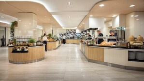 A modern, well-lit food court with multiple counters, each stocked with various food items and beverages. - Isabella Island Resort Valamar Collection 4 (Porec)