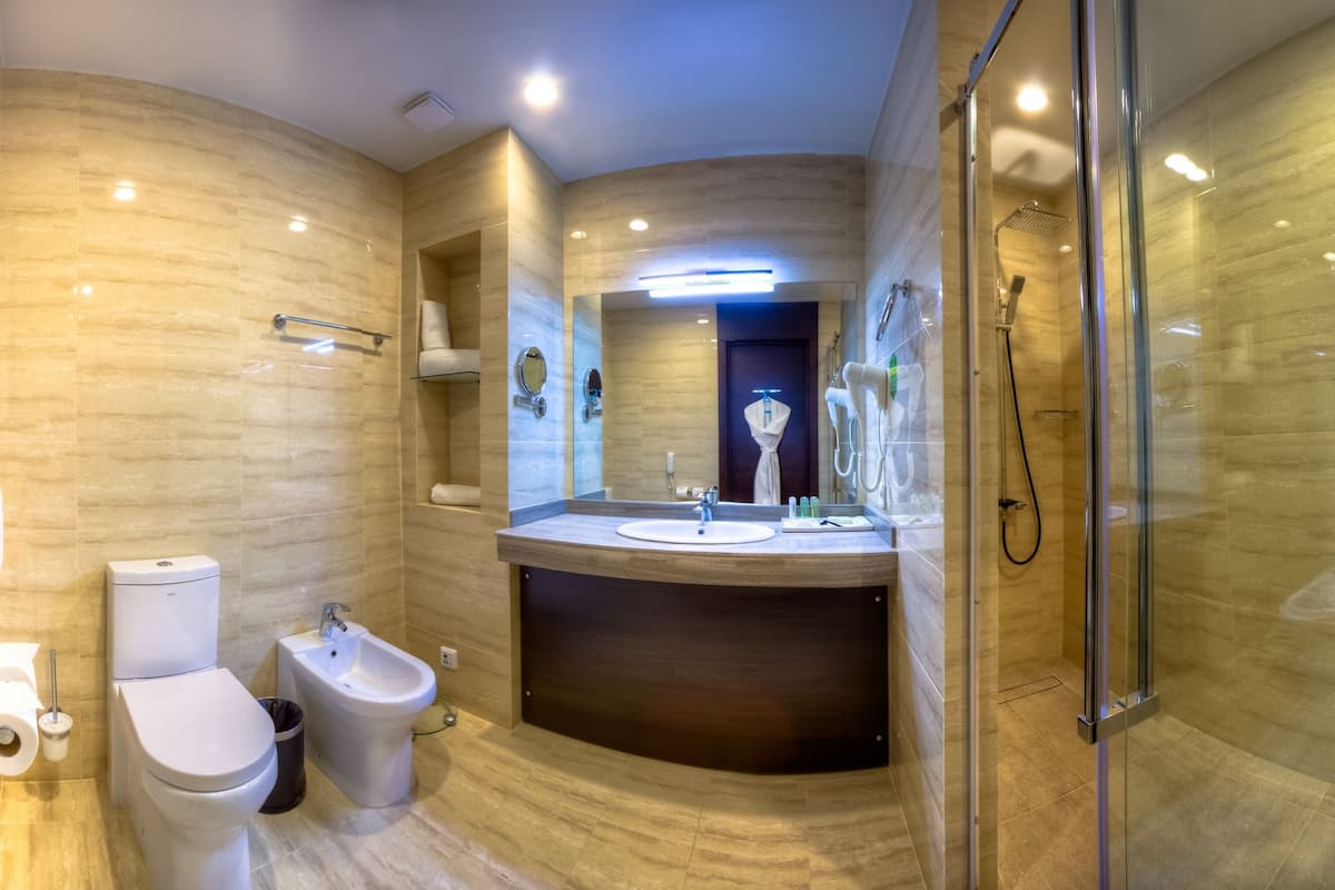 designer toiletries, hair dryer, bathrobes, slippers
