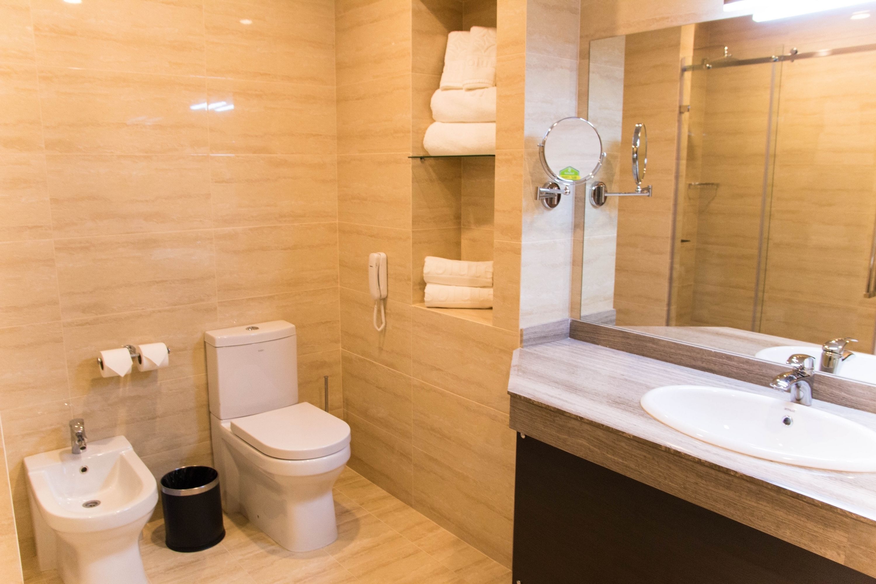 designer toiletries, hair dryer, bathrobes, slippers