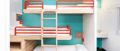 A bunk bed room with a ladder, a small window, and a sink.