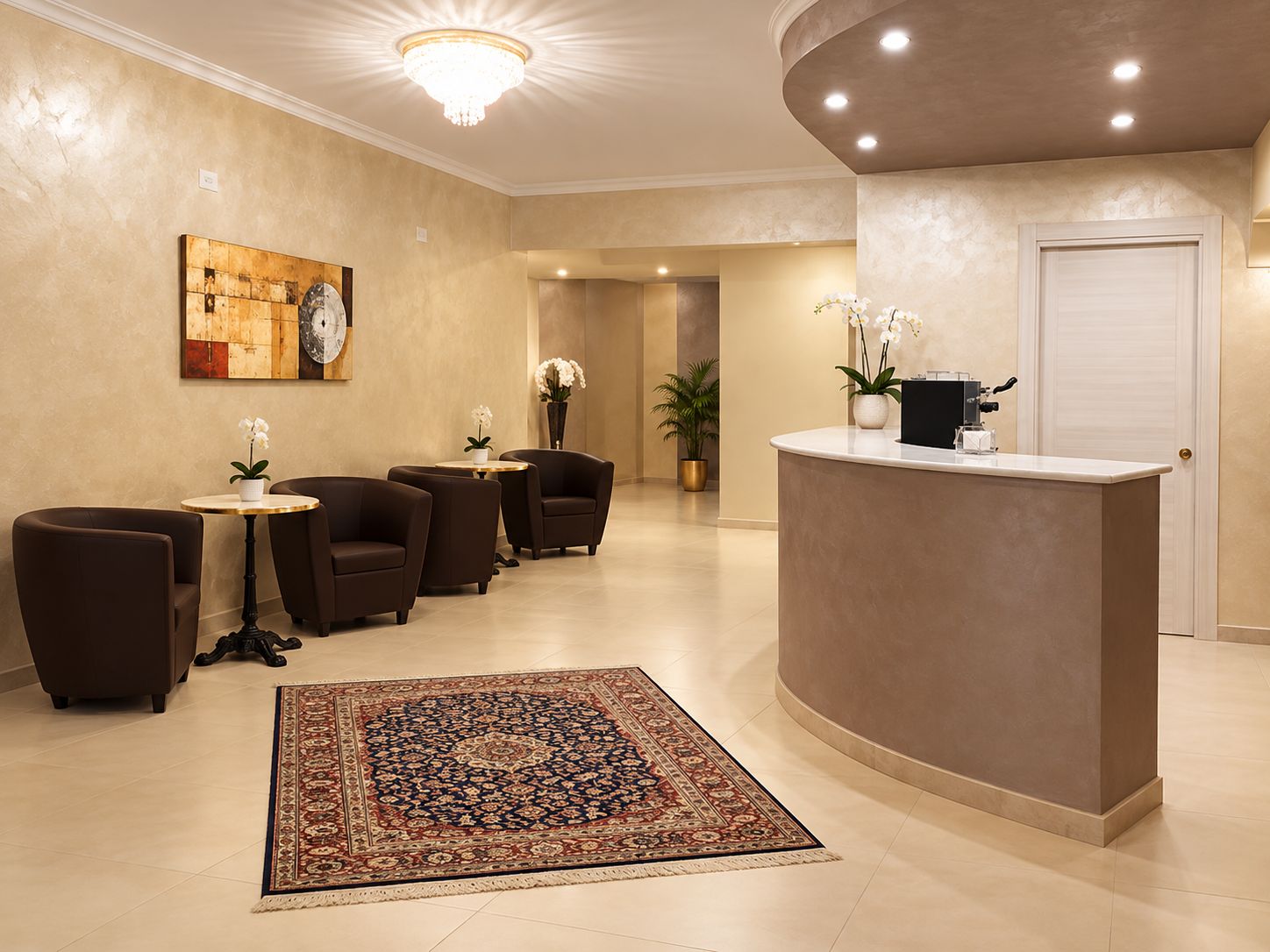 A reception area with a reception desk, seating, a patterned rug, and a chandelier.