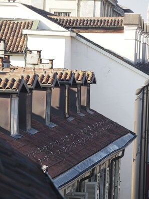 A building with multiple dormer windows and a tiled roof.