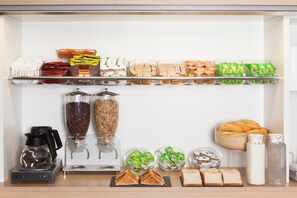 A breakfast bar with various food items and condiments. - ENZO HÔTELS 1ER PRIX Charleville Mézières (Charleville-Mezieres)