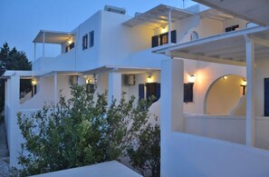 Stylish building with rounded arches and flat roofline.