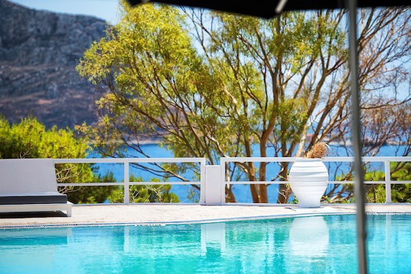 Seasonal outdoor pool, pool umbrellas, pool loungers