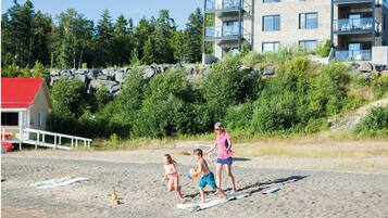 Private beach, beach umbrellas, beach towels, beach volleyball
