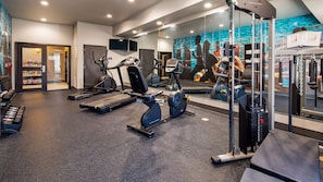 Stay fit and active in this well-equipped gym with treadmills, stationary bikes, and weight machines.