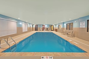 A swimming pool with a no diving sign, a lifeguard on duty sign, and a pool rules sign. - Holiday Inn Express & Suites Uniontown by IHG (Uniontown)