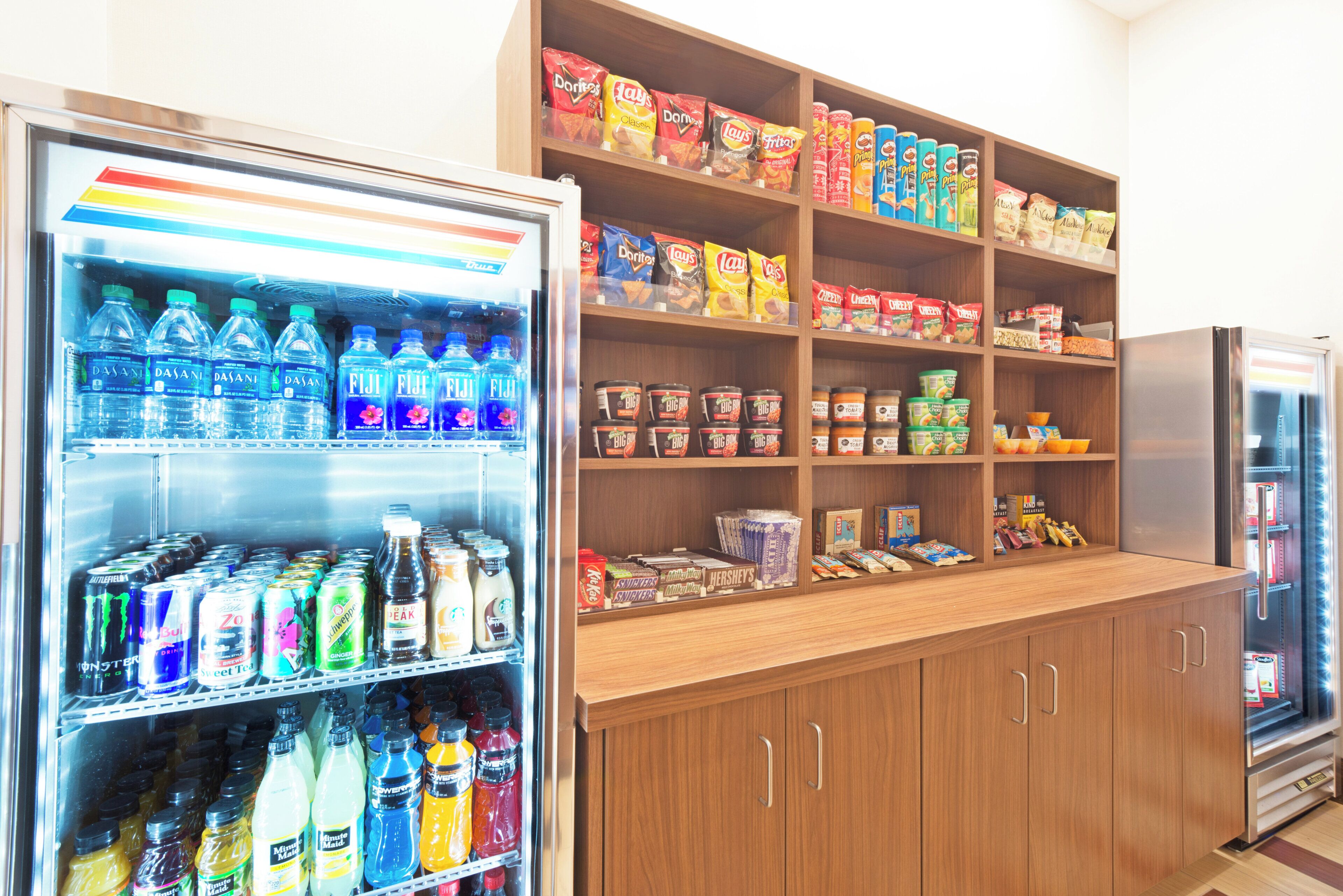 A vending machine stocked with various beverages and snacks.