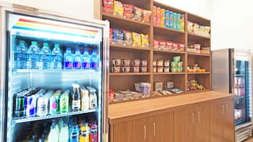 A vending machine stocked with various beverages and snacks.