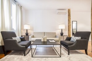 Standard Apartment, 2 Bedrooms | Living room | LED TV, heated floors - Slow Suites Augusto (Madrid)