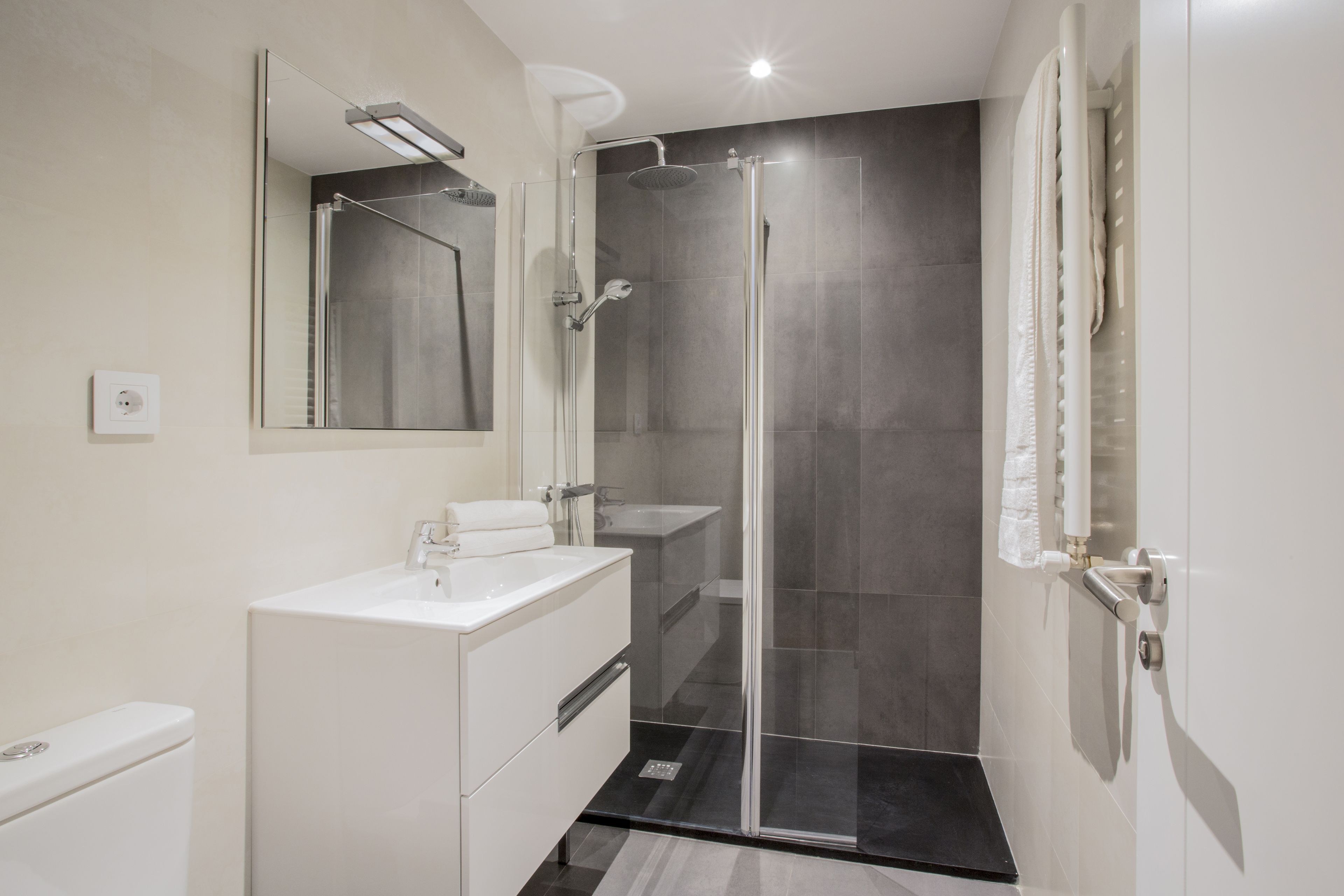 Shower, rainfall showerhead, hair dryer, towels