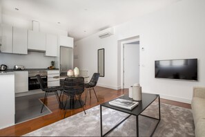 Standard Apartment, 1 Bedroom | Living room | LED TV, heated floors - Slow Suites Augusto (Madrid)