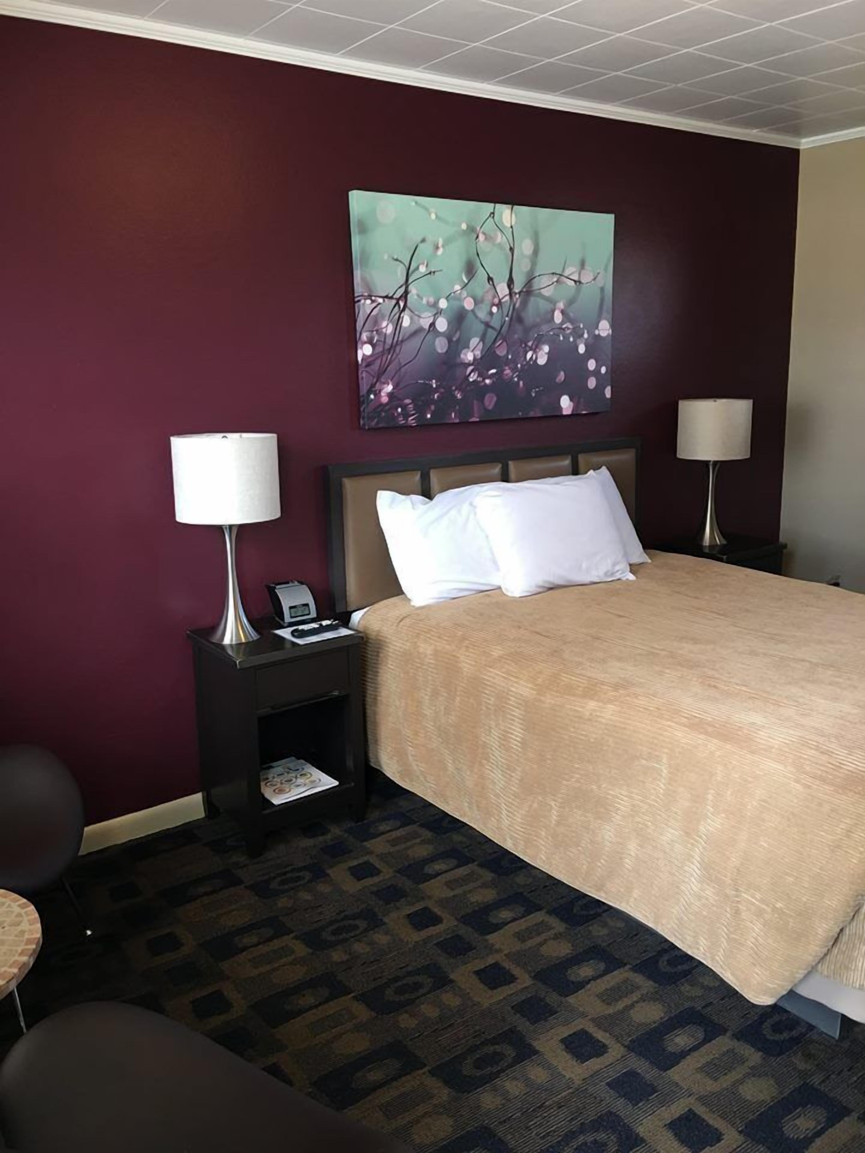 Habitación estándar, 1 cama Queen size | Ropa de cama de alta calidad y decoración personalizada 