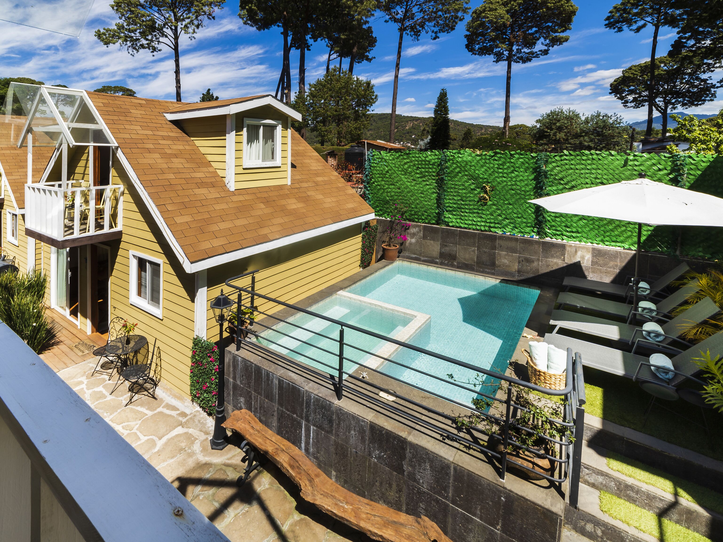 Outdoor pool, open 10:00 AM to 8:00 PM, pool umbrellas, pool loungers