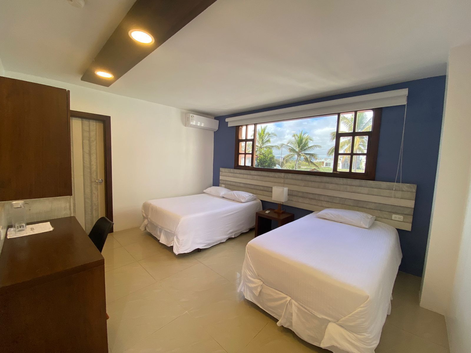 standard twin room | premium bedding, down duvets, memory-foam beds, in-room safe