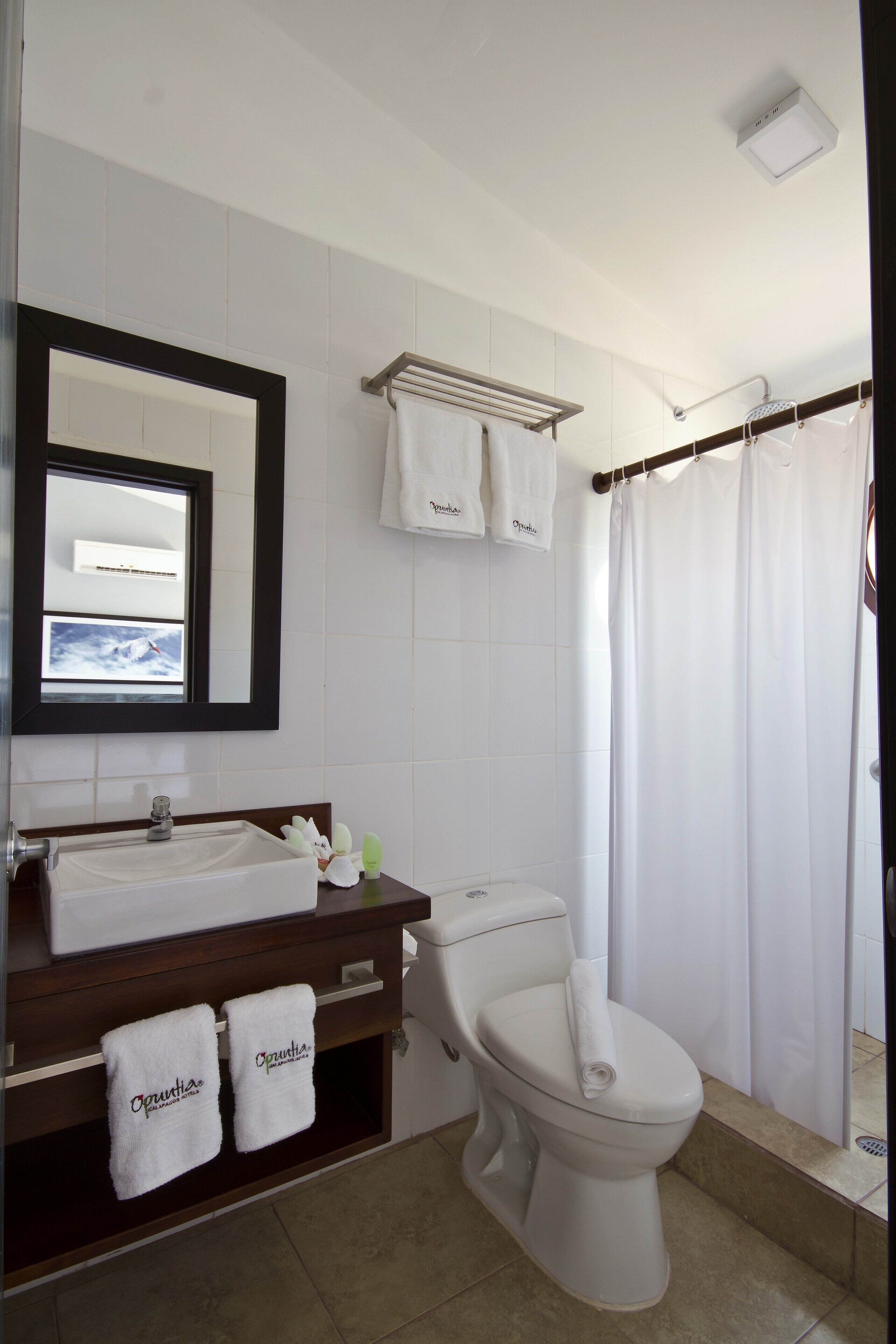 shower, rainfall showerhead, hair dryer, towels