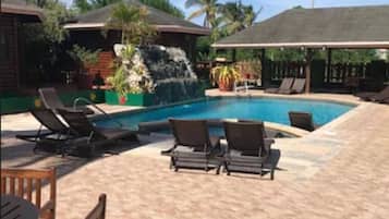 Outdoor pool, open 7:00 AM to 7:00 PM, pool umbrellas, pool loungers