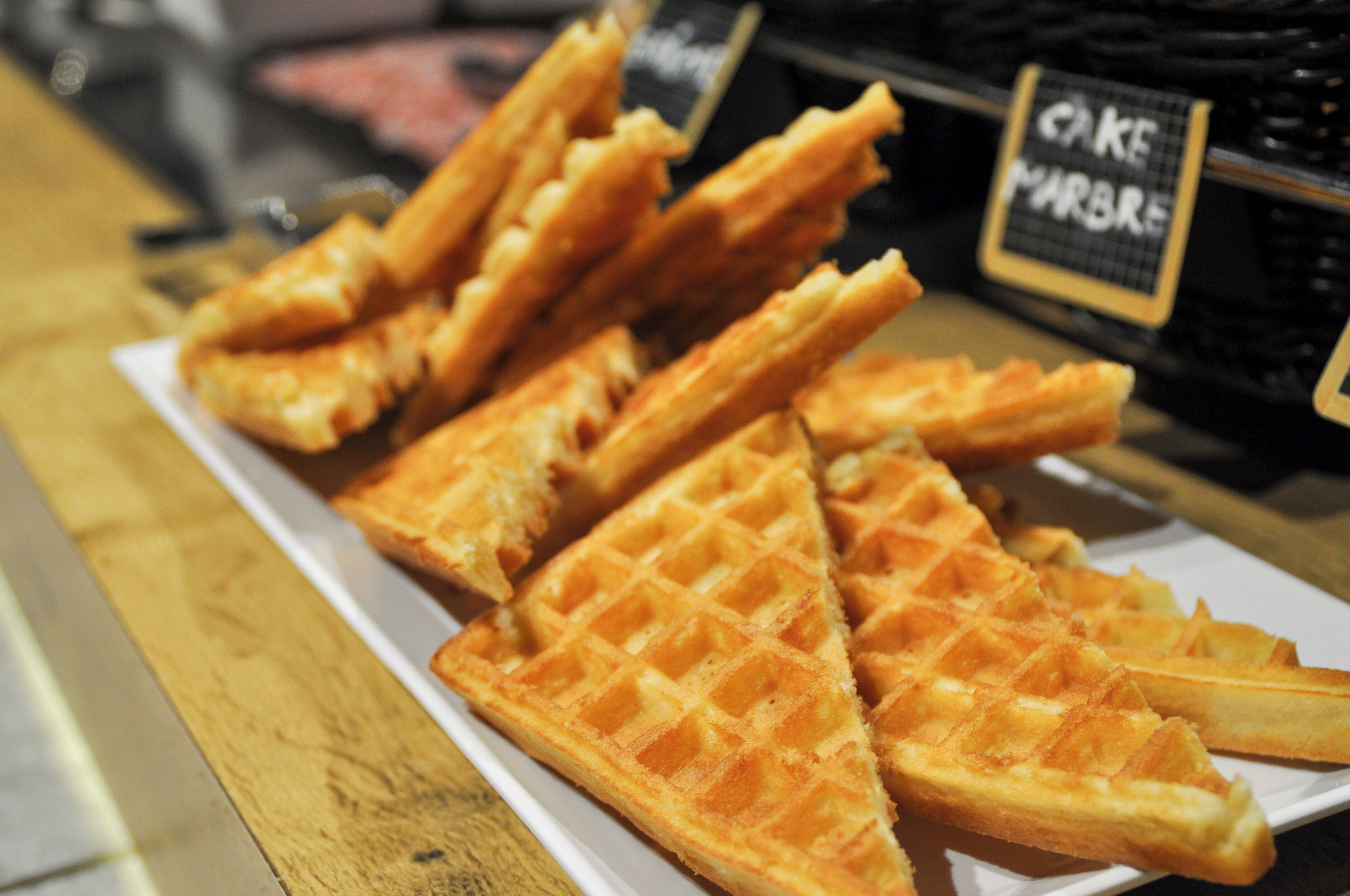 A plate of freshly made waffles.
