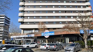 A multi-story hotel with a modern design, featuring balconies on each floor and a sign for 'ibis budget' at the top. - ibis budget Toulouse Centre Gare (Toulouse)