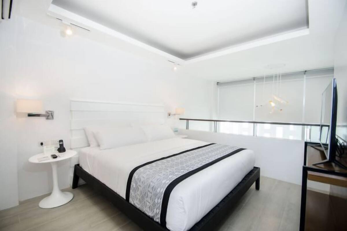 Premium bedding, down comforters, pillowtop beds, minibar
