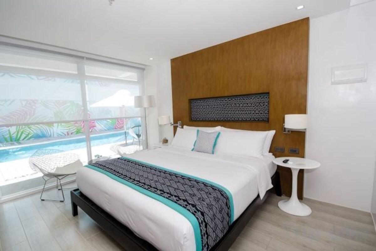 Premium bedding, down comforters, pillowtop beds, minibar