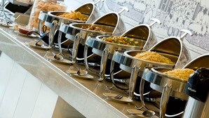 A buffet line with multiple serving stations. - Amaris Hotel Malioboro Yogjakarta (Yogyakarta)