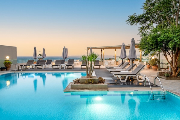 Seasonal outdoor pool, open 10:00 AM to 6:00 PM, pool umbrellas