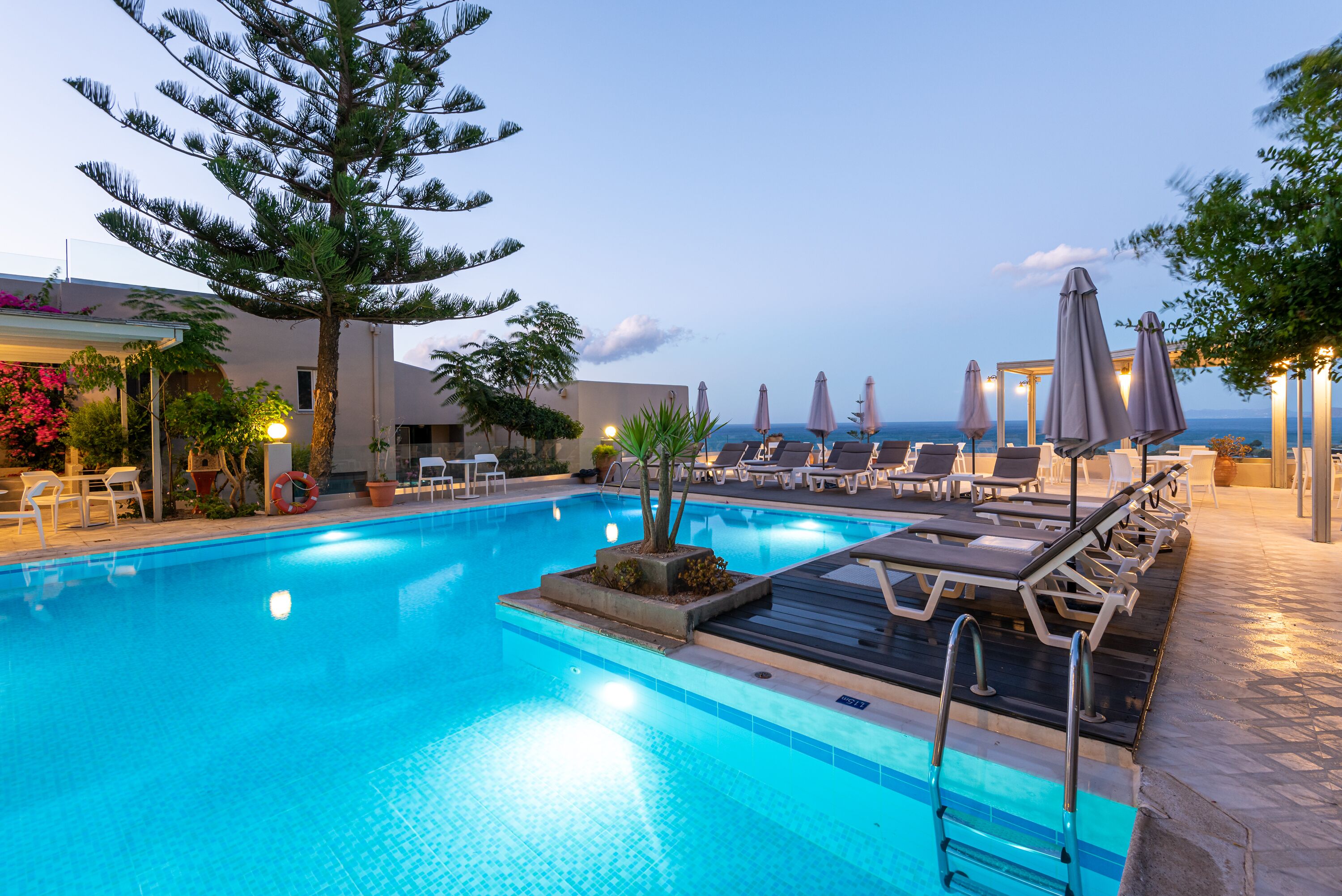 seasonal outdoor pool, open 10:00 am to 6:00 pm, pool umbrellas