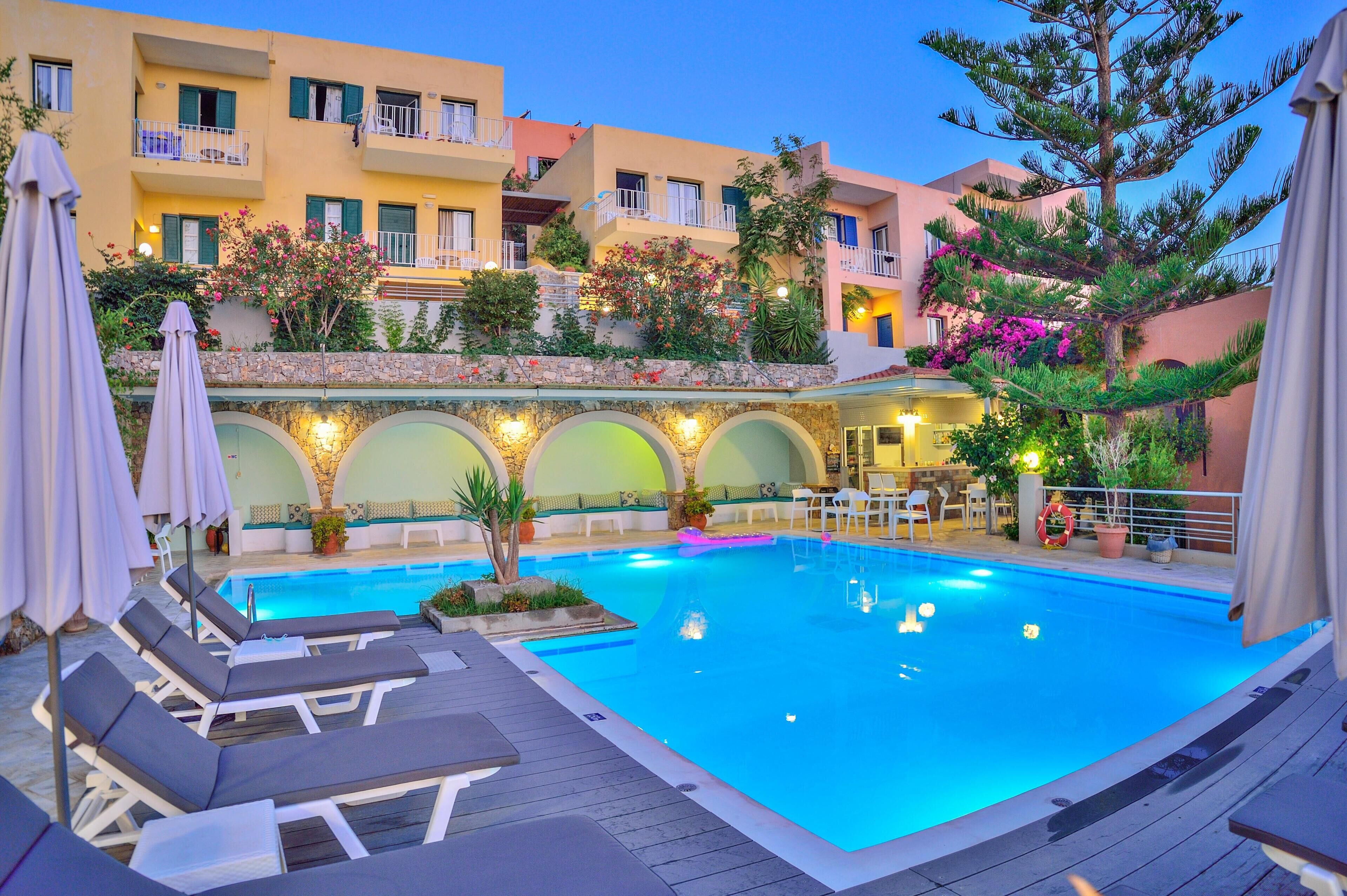 Seasonal outdoor pool, open 10:00 AM to 6:00 PM, pool umbrellas