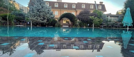 Seasonal outdoor pool, pool umbrellas, pool loungers