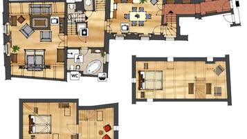 A hotel layout with multiple rooms, a dining area, and a kitchen.