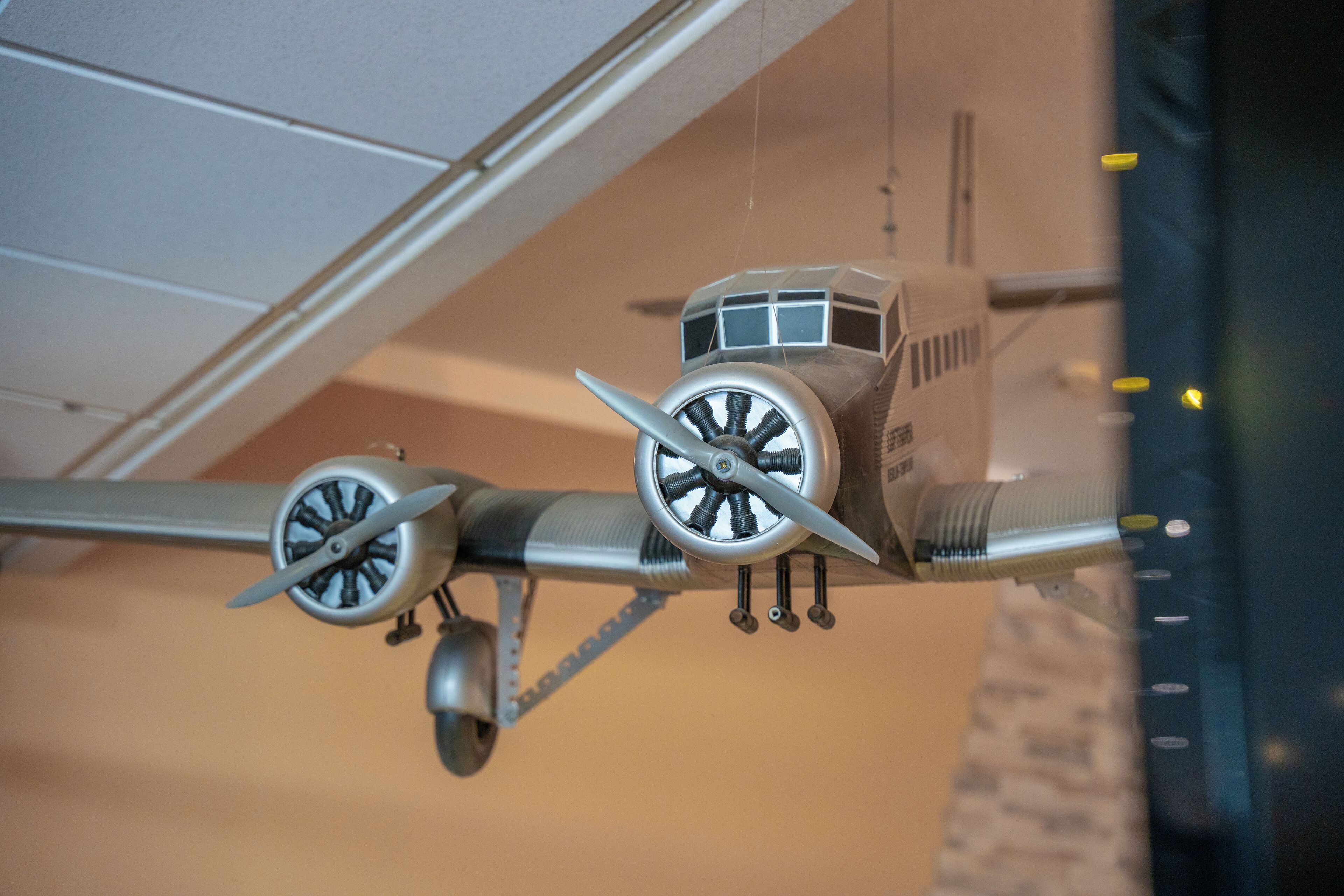 A model airplane with propellers and landing gear.