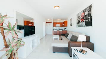 Superior Apartment, 1 Bedroom | Living area | 32-inch flat-screen TV with satellite channels, TV