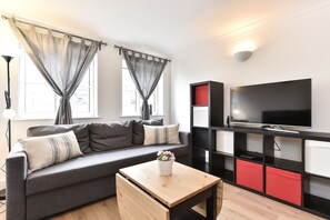 Apartamento superior, 2 quartos | Sala de estar