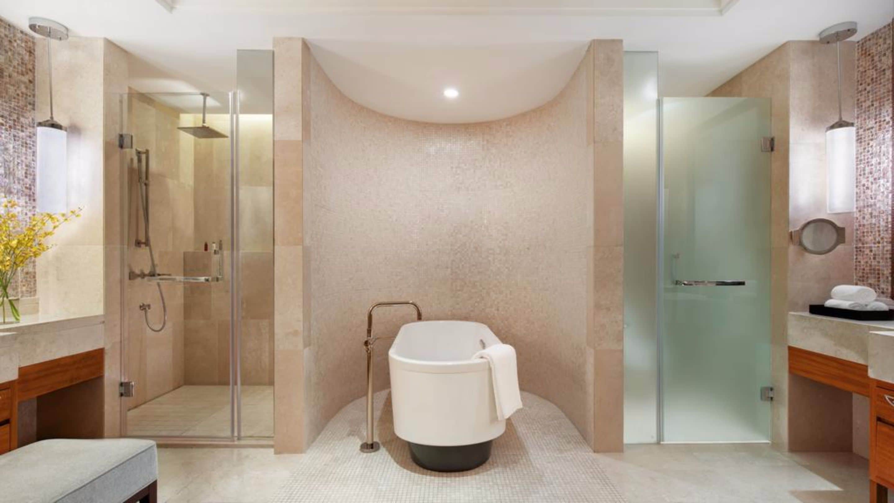 separate bathtub and shower, hair dryer, bathrobes, towels