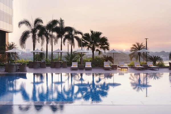 2 outdoor pools, open 6:00 AM to 10:00 PM, pool umbrellas
