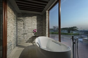 Separate tub and shower, rainfall showerhead, eco-friendly toiletries