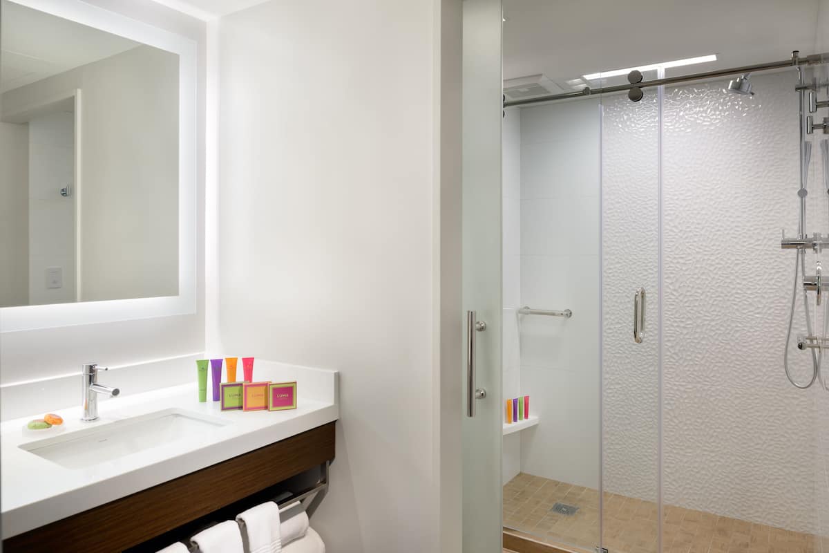 room, 1 king bed | bathroom | designer toiletries, hair dryer, bathrobes, slippers