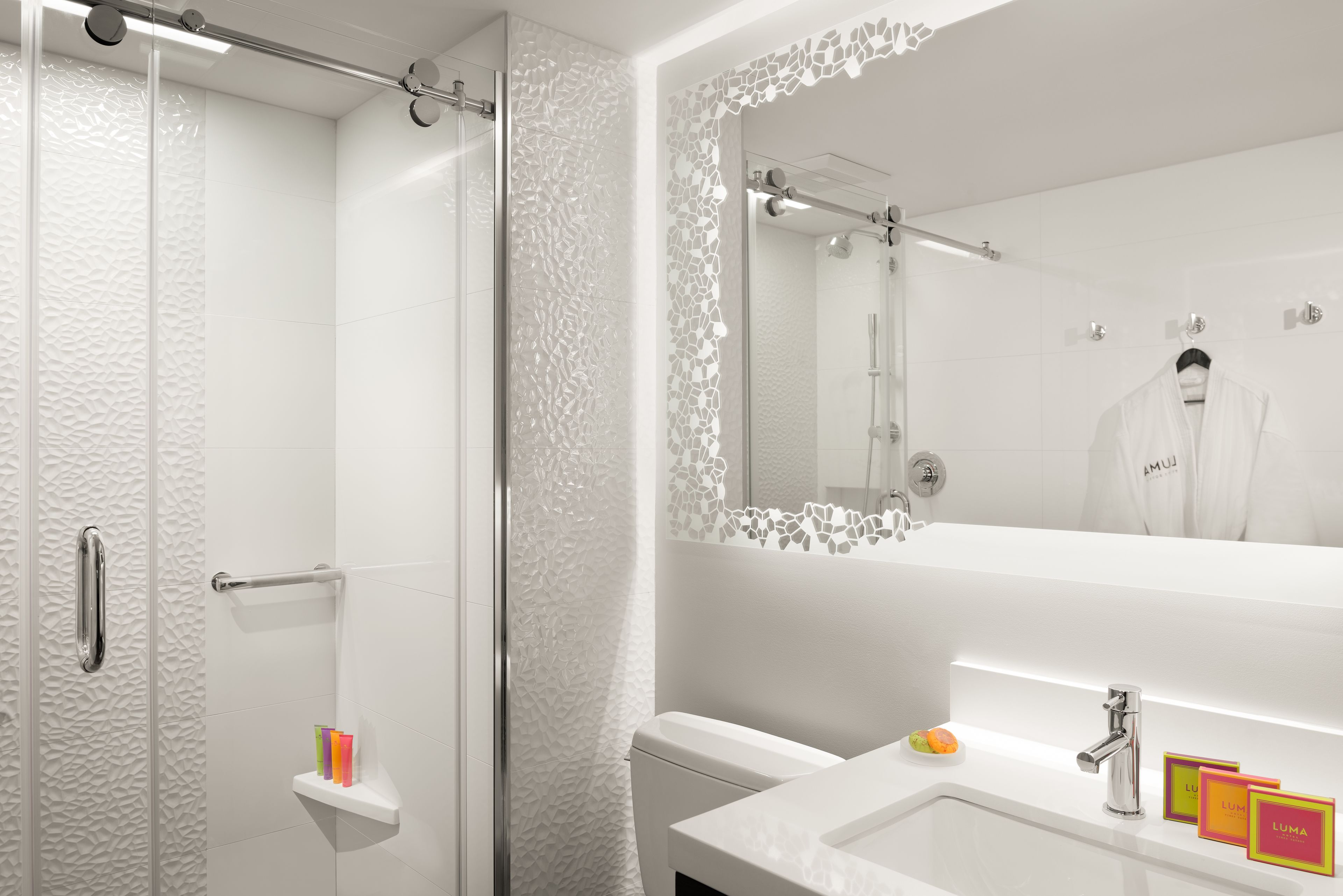 designer toiletries, hair dryer, bathrobes, slippers