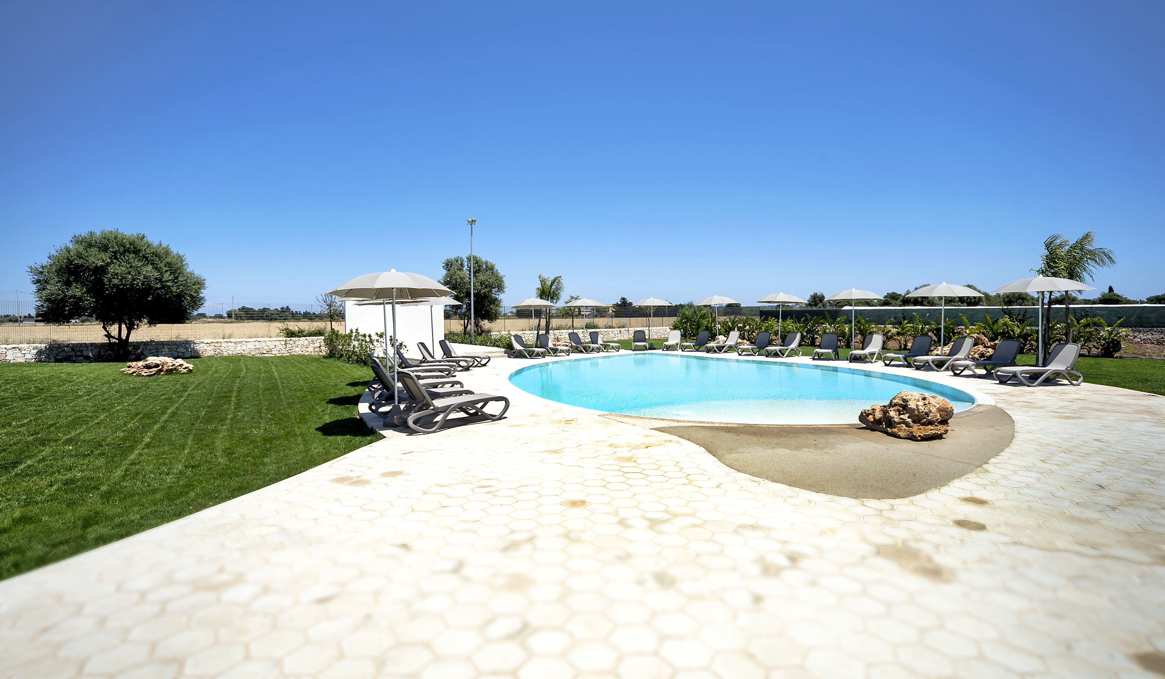 seasonal outdoor pool, open 8 am to 8 pm, pool loungers