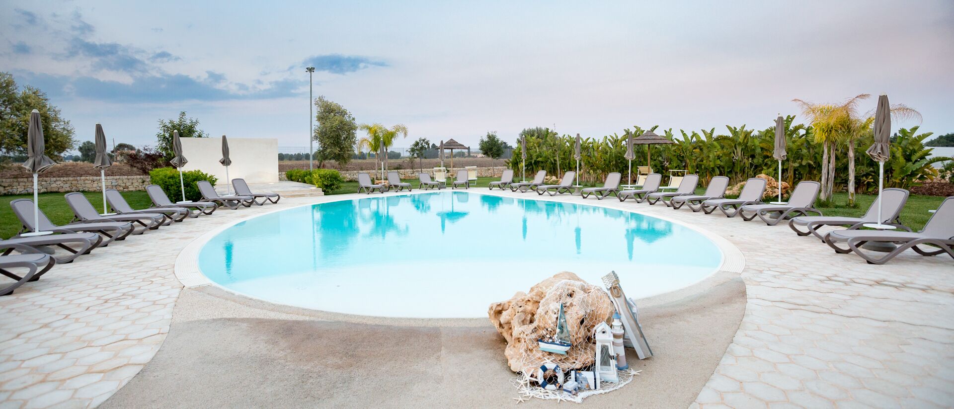 seasonal outdoor pool, open 8 am to 8 pm, pool loungers