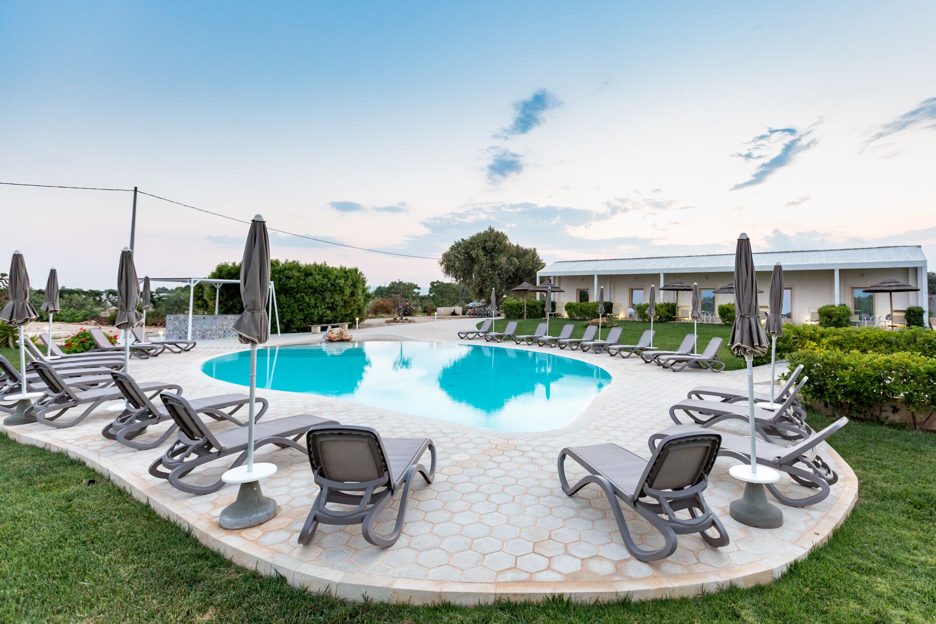 seasonal outdoor pool, open 8 am to 8 pm, pool loungers