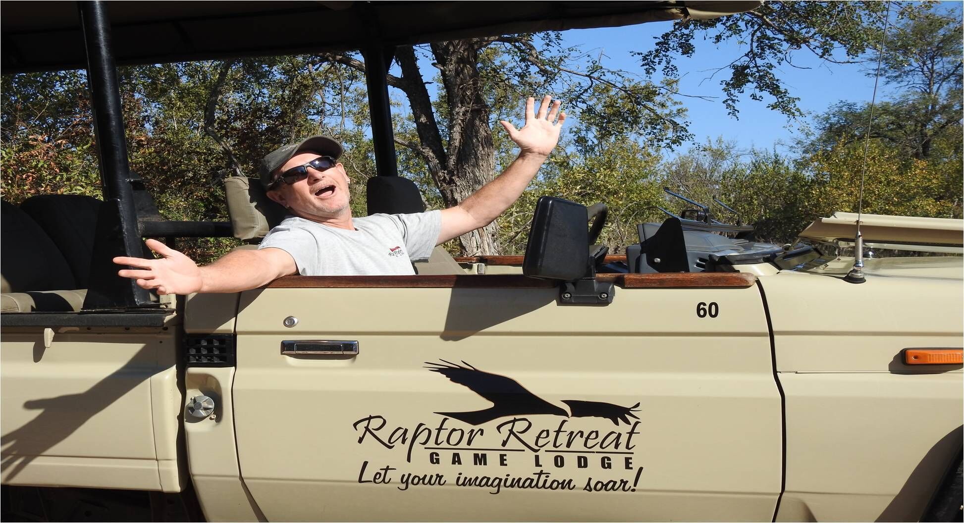 A beige vehicle with a raptor retreat logo and the text "Let your imagination soar!"
