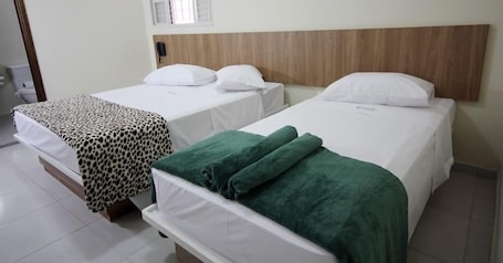 Triple Room | Minibar, in-room safe, desk, blackout drapes