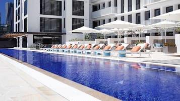 Outdoor pool, pool umbrellas, sun loungers