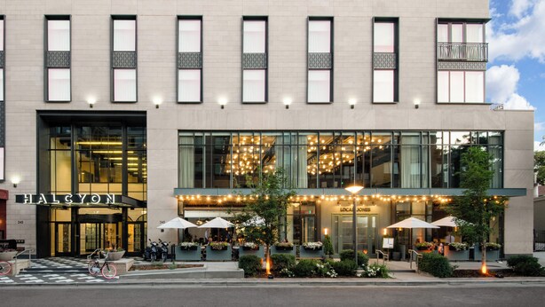 A modern building with large windows and outdoor seating areas. - Halcyon, a hotel in Cherry Creek, Denver (Denver)
