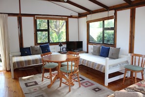 Treehouse Cottage | Living area | Flat-screen TV - Treehouse Cottage (The Crags)